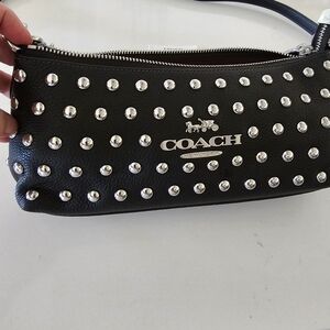Coach small studded black leather bag.